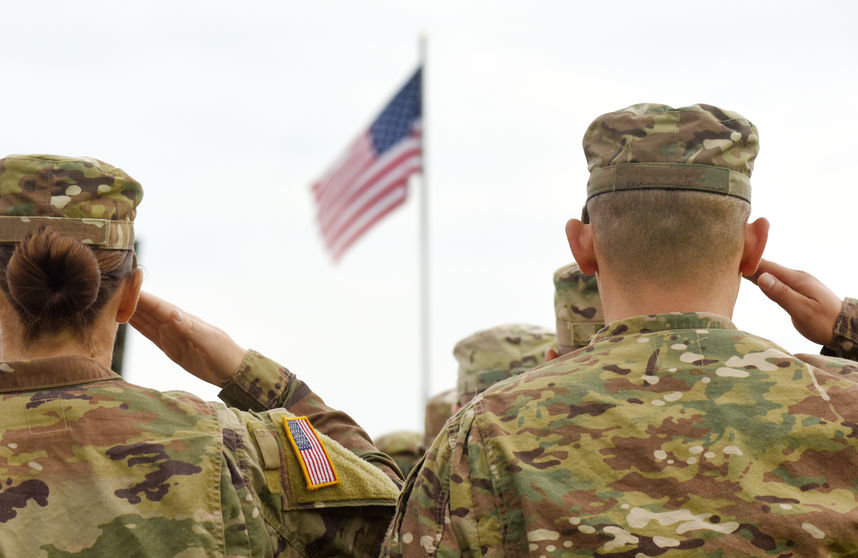 American Soldier Salute The American Flag Amidst Conversation On Student Loan Forgiveness For America's Disabled Vets